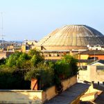 Exterior view of the concrete dome of Pantheon from roof tops